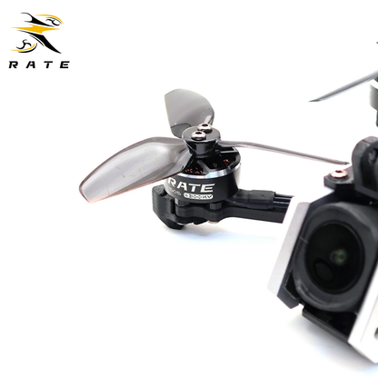 Macro close-up of RATE custom brushless motor with printed KV marking and transparent propeller for S30 O4 3-inch FPV drone, precision power component for stable freestyle flight.